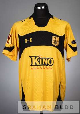 Ronaldo Guiaro orange and black Aris Salonika no.5 home jersey v Manchester City in the UEFA Europa League round of 32 second leg at City of Mancheste