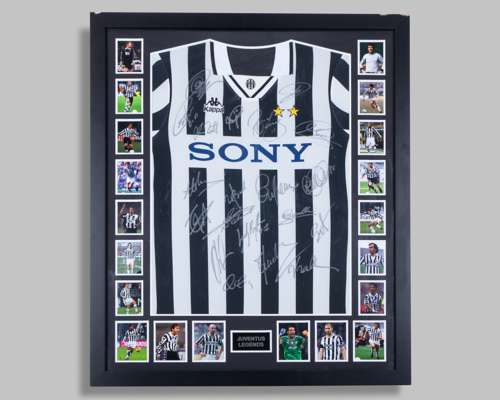 A black and white Juventus autographed replica shirt display