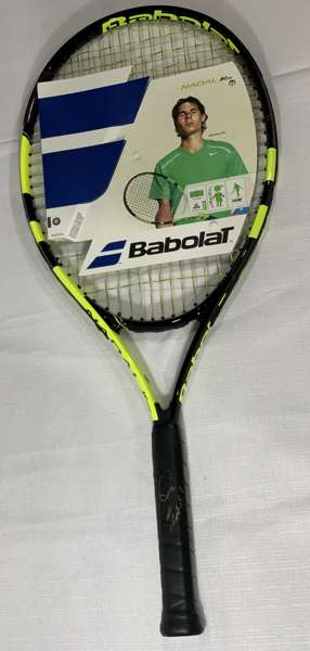 Rafael Nadal (Spain) signed Babolat tennis racquet,
 same brand as he uses, signed on black grip with Gold Sharpie. Nadal is the World Record holder o