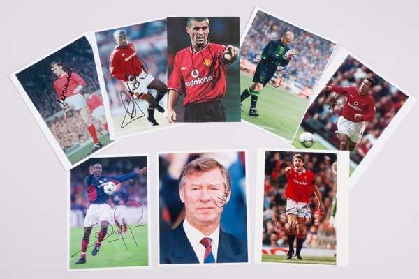 A collection of twenty-four Manchester United related autographed pictures