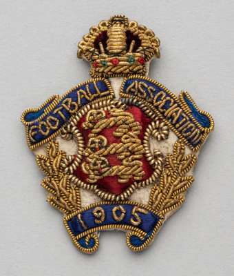 Football Association badge 1905,
 silk and wirework badge with FOOTBALL ASSOCIATION 1904 and three lion emblem, reverse with lapel pin clasp, and make