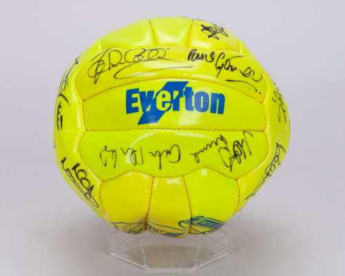 A yellow Everton autographed football