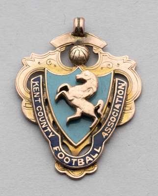 9ct gold & enamel Kent County FA Senior Cup winners medal 1907-08,
 inscribed with competition details, weight 10gms.

 The winner this season was Tun
