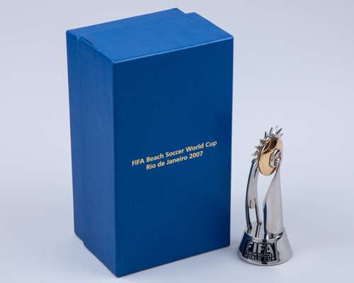 Four FIFA miniature trophies