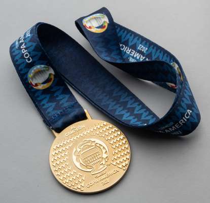 A gilt-metal 2021 Copa America Winner's medal, 
 the obverse inscribed Al Campeon, Conmebol, Copa America 2021, the reverse inscribed 1916 with origin