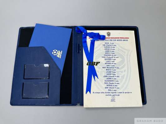 A portfolio tribute of drawings and messages from 23 children, 
 ages 8 to 11, presented to Pelé by the Austrian Brazilian Soccer School. Also enclose