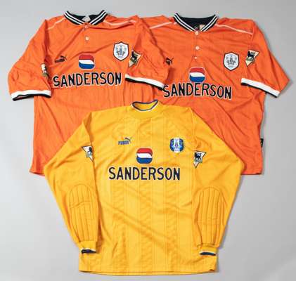 Three Sheffield Wednesday Premier League away match jerseys,
 comprising Des Walker orange no.6 jersey; Junior Agogo orange no.23 jersey and Lance Key