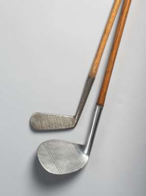 A 'Giant' niblick golf club by LB 76 Jermyn Street, London,
 hickory shaft with leather grip, length 93cm., club head 3.25 by 3.75in., sold together w