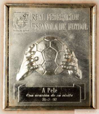 A framed silver tone tribute plaque from the Royal Football Federation of Spain
 presented to Pelé on the occasion of his visit on February 21, 1992, 