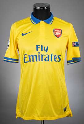 Santi Cazorla yellow and blue Arsenal no.19 jersey from the 2013-14 Champions league campaign.
 Player issued short sleeved NIKE example with the UEFA