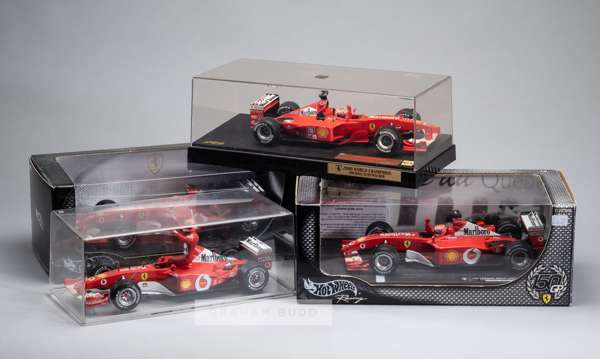 Group of thirteen Ferrari 1:18 scale model cars, predominantly Hotwheels all in original boxes,
 Various Ferrari F1 cars and drivers including Schumac