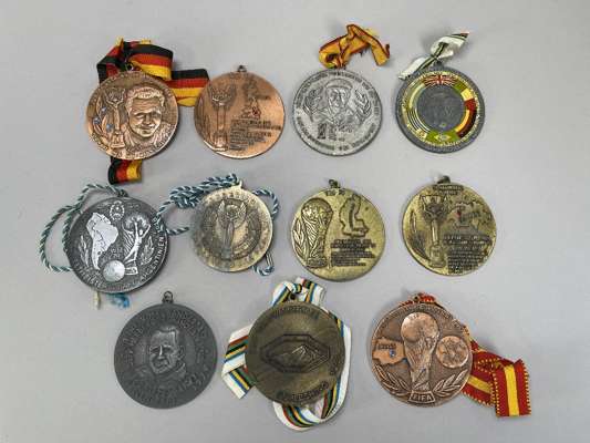 Various German large heavy metal World Cup medallions, 
 some with ribbons attached, they cover 1950 (1), 1954 (2), 1966 (1), 1974 (1), 1978 (2), 1982