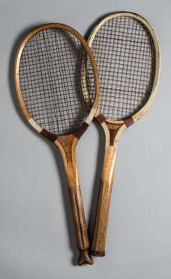 A very good fishtail tennis racket “The Windsor” circa 1920, 
 with only two breaks to the bi-colour strings and “The Club” racket, circa 1900, in exc