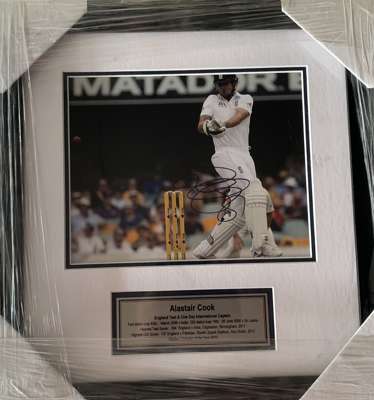 England: Sir Alaistair Cook signed 8 by 10in. photograph,
 professionally framed / glazed, double matted and plaque. Frame Size: 42 by 40cm., Cook hol