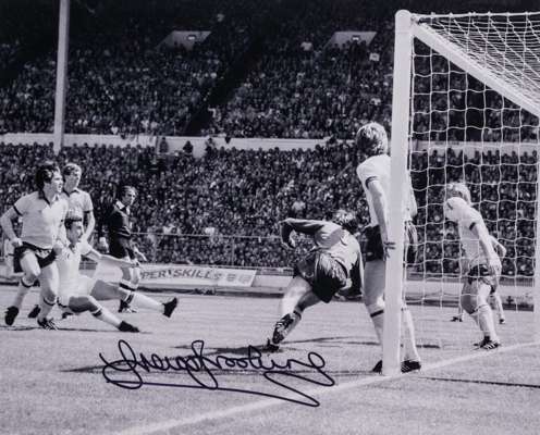 West Ham United's Trevor Brooking signed b & w photographic print of the winning goal v Arsenal in the 1980 FA Cup final, 
 signed in black marker pen