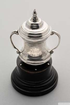 Rare miniature 1914 white-metal F.A.Cup trophy
 inscribed F.A. Challenge Cup Burnley F.C., Winners 1913-14 on socle base, 8cm high

 In the 1914 F.A.C