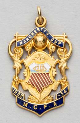 Manchester Senior Cup runners-up medal awarded to Manchester City's L. Langford, 1933-34,
 obverse with enamelled shield and lettering MANCHESTER CUP 