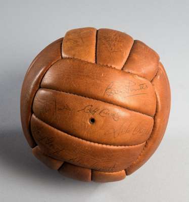 A football signed by the Hereford United team in the John Charles player/manager era, brown leather football extensively signed in biro and including 