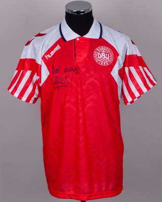 A Peter Schmeichel autographed red and white Denmark replica short-sleeved shirt