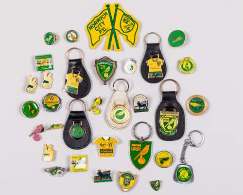 Collection of Norwich City FC badges and keyrings