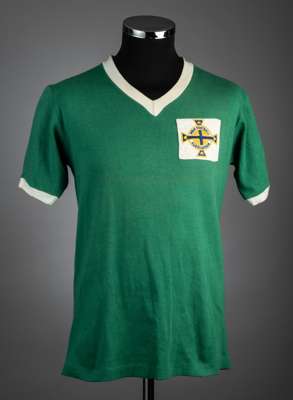 A green Northern Ireland No.7 international jersey reputed to have been worn by George Best in his first year of international football in 1964,
 with