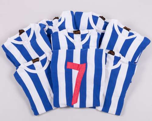 Eight blue and white Litesome Sportswear numbered long-sleeved shirts