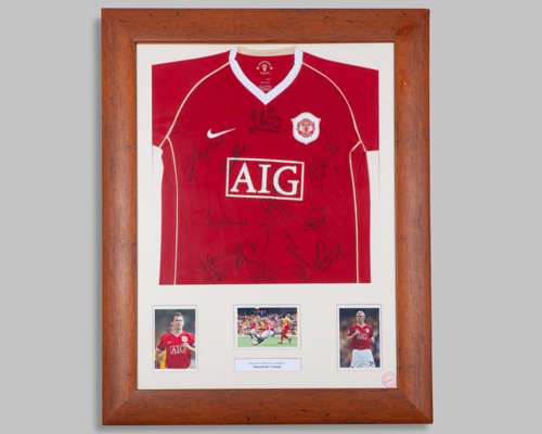 A red replica Manchester United autographed shirt