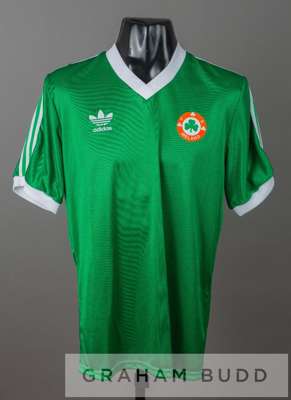 Green Republic of Ireland no.9 home jersey, circa 1987,
 by Adidas, short-sleeved with white collar and cuffs, FA IRELAND country badge and sponsor lo