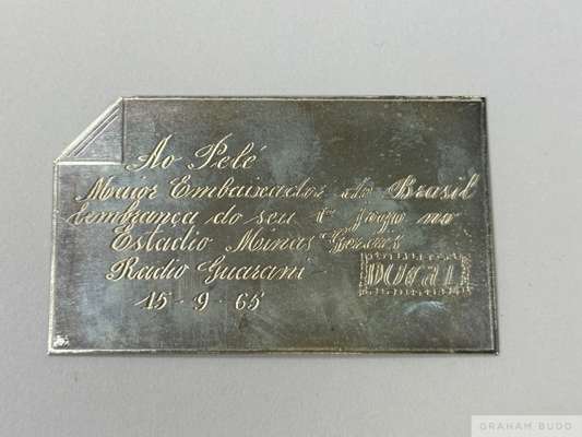 A silver tone plaque presented to Pelé on September 15, 1965, by Rádio Guarani of Belo Horizonte, Minas Gerais, Brazil. 
 The plaque commemorates Pelé