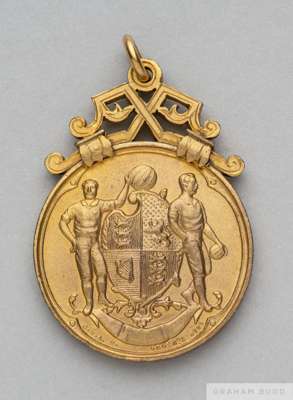 An interesting specimen F.A. Cup winner's medal circa 1900
 design produced in gilt-metal by the medal maker for approval by The Football Association
