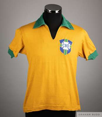 Jairzinho yellow and green No.17 Brazil v. Argentina match worn short-sleeved shirt
 with v-neck collar and embroidered cloth badge inscribed CBD

The