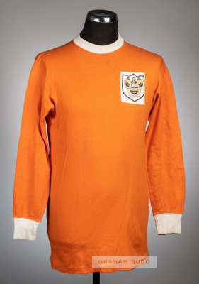 A tangerine Blackpool home jersey, circa 1966,
 Umbro, long-sleeved with club crest badge, unnumbered

 This is a Blackpool jersey dating from the mid