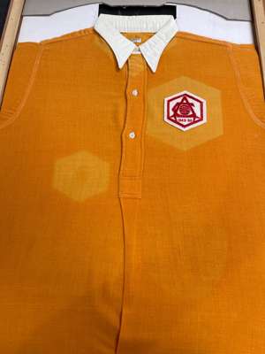 Alex Forbes yellow Arsenal No.4 1950 F.A. Cup Final jersey,
 Hope Brothers Ltd, with white collar and bearing felt hexagonal chest badge embroidered w