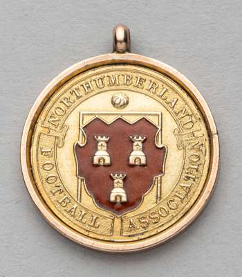 Northumberland Football Association Senior Cup winner's medal awarded to Newcastle United's Edwin Dutton 1911-12,
 obverse with red enamelled shield a