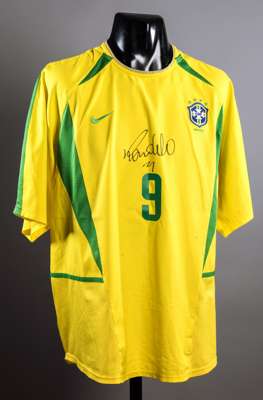 Ronaldo signed replica of his Brazil 2002 World Cup Final jersey, signed in black marker pen