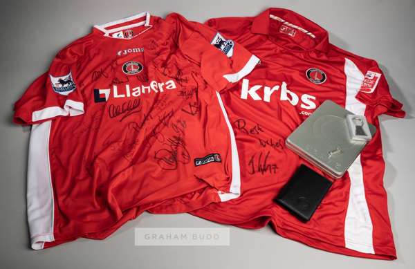 Two red and white Charlton Athletic signed home jerseys, season 2005-06 & 2009-10,
 comprising a squad signed Marcus Bent 2005-06 no.6 short-sleeved j