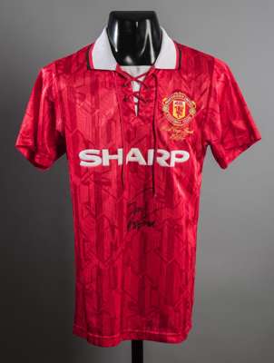 Eric Cantona signed replica of his Manchester United 1994 F.A. Cup Final jersey, signed in black marker pen