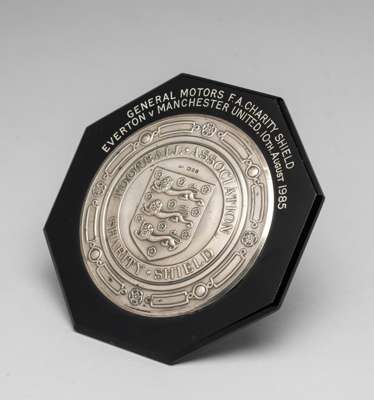 Manchester United v Liverpool 1990 F.A. Charity Shield medal plaque,
 being a miniature of the competition trophy, hallmarked silver, black bakelite b