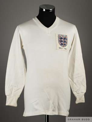 Jimmy Melia white No.10 England v. Scotland International debut match worn long-sleeved shirt, 1963, 
 Bukta, 38, with v-neck collar and embroidered t