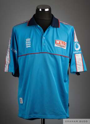 David Lloyd blue Wills International Cup shirt, 
 Asics, XL, with button-up collar and embroidered three lion badge and Wills International Cup badge,