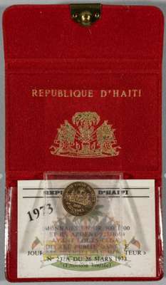 World Cup 1974 Germany small gold coin in wallet with card issued by Haiti, 
 who only ever qualified for World Cup finals in 1974. The coin is 900/10