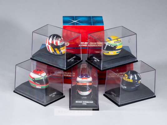 Group of 24 Minichamps 1:8 scale F1 Helmets,
 Including 6 from the Michael Schumacher collection, others include Senna, Hill, Alesi, Villenueve, (24)