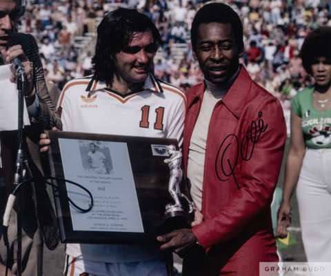 A large colour portrait photograph of Pele and George Best,
 signed in black marker pen on the front and accompanied by a certificate of authenticity 