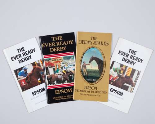 Four Epsom Derby racecards signed by the winning jockey