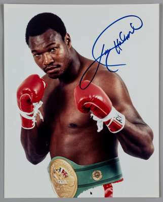 Larry Holmes World Heavyweight Boxing Champion 1978-85 original autographed colour 10 by 8in. photograph, 
 depicting the former heavyweight boxing ch