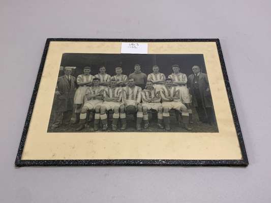 A black and white Leeds United team line-up photograph, 1934-35 
 12 by 20cm, glazed