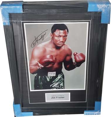 Boxing: Smokin Joe Frazier signed & framed boxing photograph display, 
 mounted with photograph and engraved metal plaque, frame measures 27 x 20in., 