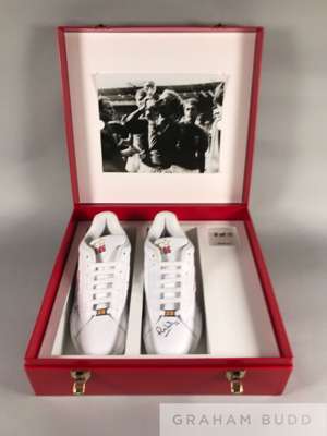 A unique pair of white Reebok trainers signed by 10 of the 1966 England World Cup squad