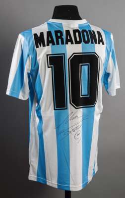 Diego Maradona signed replica of his Argentina 1986 World Cup Final jersey, signed to the reverse in black marker pen below the No.10