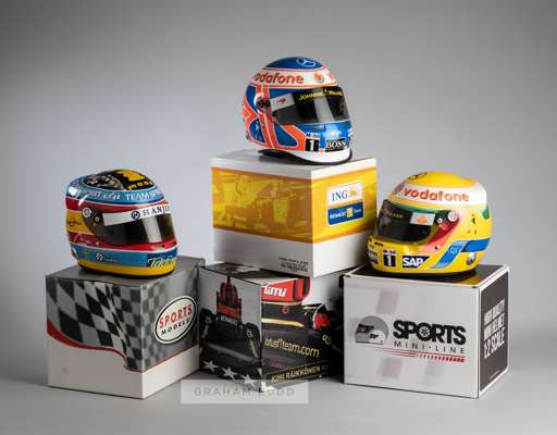 Collection of 13 1:2 scale F1 driver replica helmets,
 ten in original boxes from different manufactures, including Button, Fisichella, Mansell, Monto